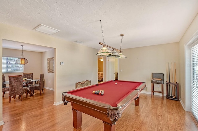 1833 Sandalwood Dr, Sarasota, FL 34231 - game room featuring light wood-type flooring, plenty of natural light, billiards table, baseboards, and a textured ceiling