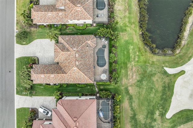 birds eye view of property featuring a water view