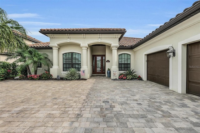 entrance to property featuring a garage