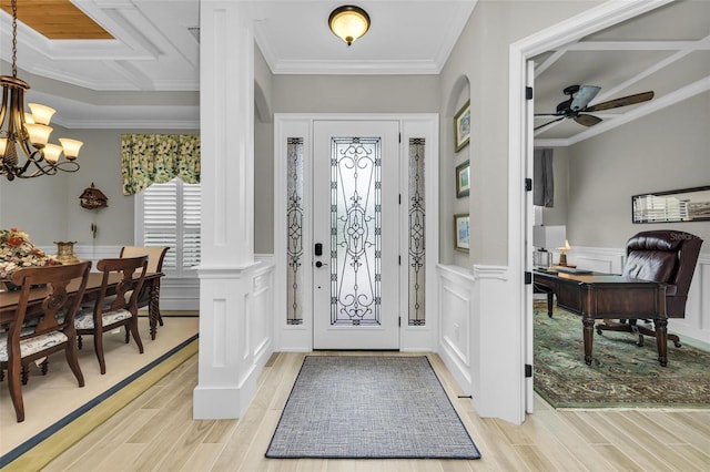 entrance foyer with crown molding and light hardwood / wood-style flooring