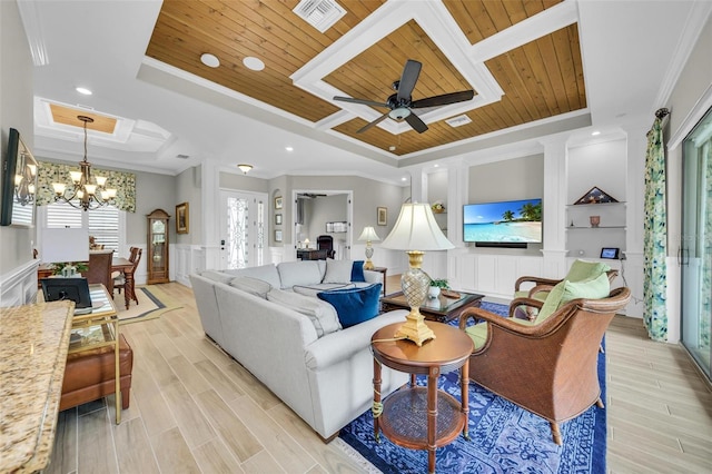 living room with light wood-type flooring, ceiling fan with notable chandelier, crown molding, a tray ceiling, and wood ceiling