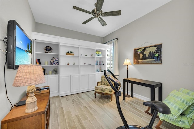 living area with light hardwood / wood-style flooring and ceiling fan