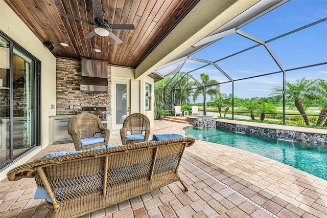 view of pool featuring a lanai, a patio area, pool water feature, area for grilling, and ceiling fan