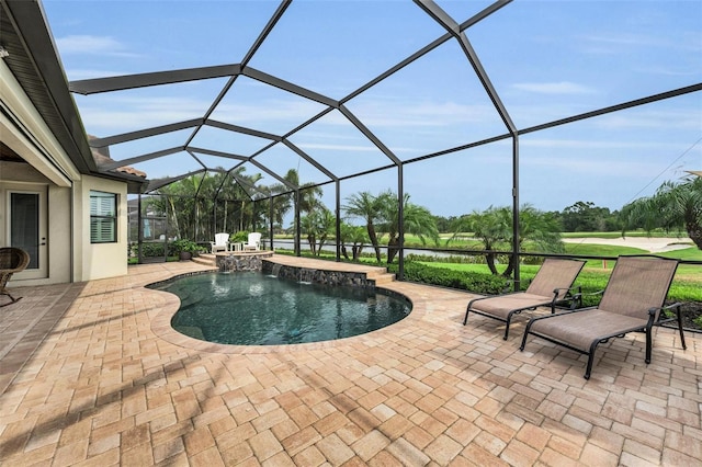 view of swimming pool with glass enclosure, pool water feature, and a patio