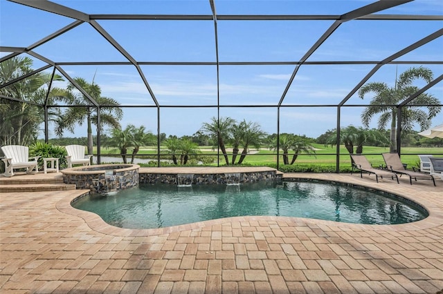 view of swimming pool featuring pool water feature, a lanai, an in ground hot tub, and a patio area