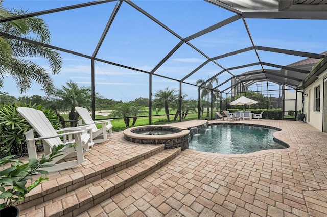 view of swimming pool with glass enclosure, a patio area, and an in ground hot tub