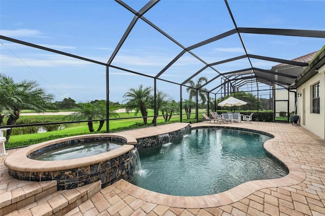 view of swimming pool with glass enclosure, a patio area, an in ground hot tub, and pool water feature