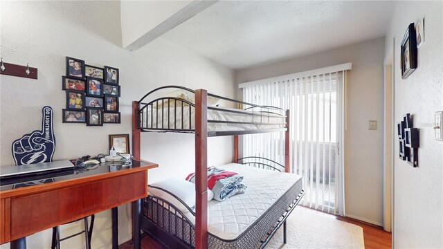 bedroom with wood-type flooring