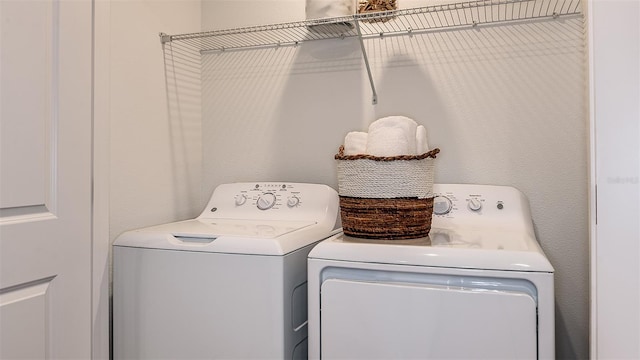 laundry area with washing machine and dryer