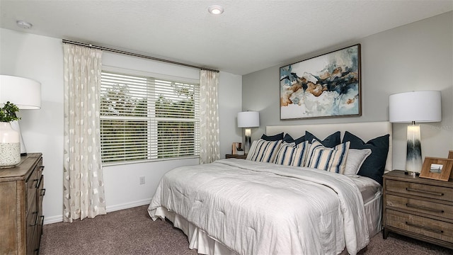 carpeted bedroom featuring a textured ceiling