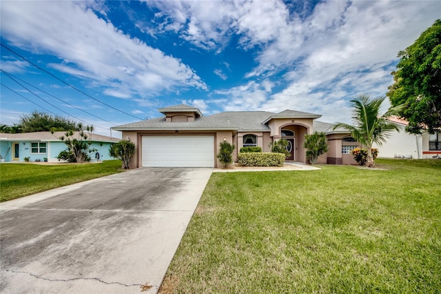 view of front of property with a garage and a front lawn