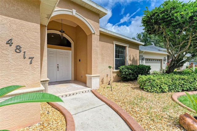 property entrance with a garage