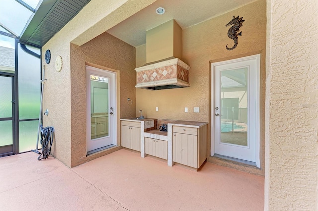 interior space with sink and an outdoor kitchen