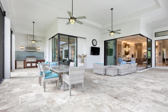 view of patio with outdoor lounge area, an outdoor kitchen, and grilling area