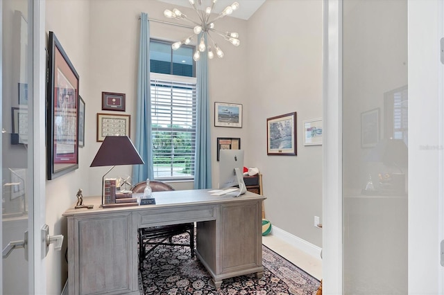 office space featuring an inviting chandelier