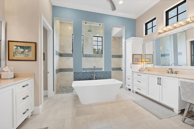 bathroom with tile patterned floors, vanity, and separate shower and tub