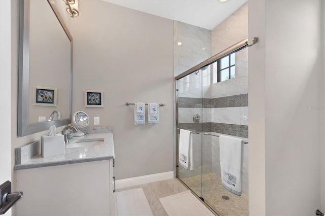 bathroom featuring an enclosed shower and vanity