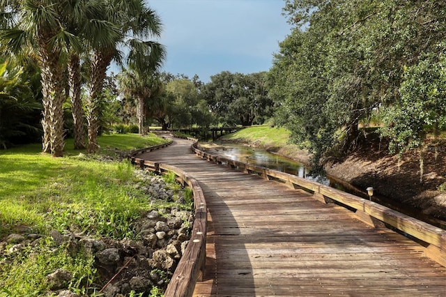 surrounding community featuring a water view