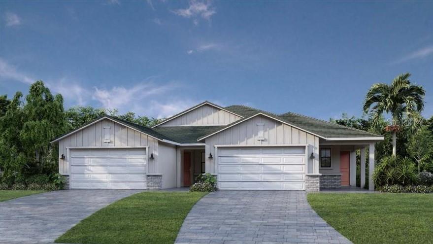 single story home with a garage and a front lawn