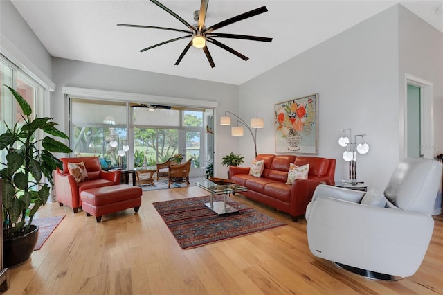 living room featuring light hardwood / wood-style flooring and ceiling fan