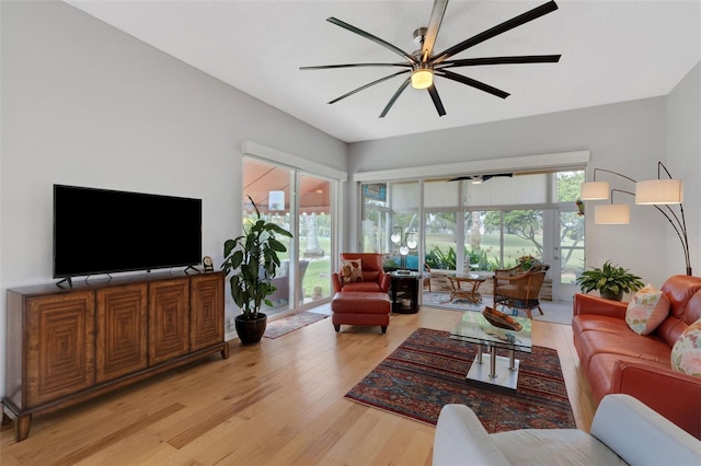 living room with light wood-type flooring and ceiling fan