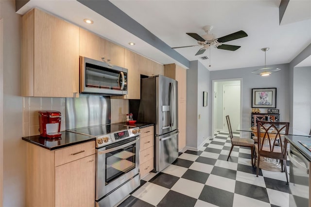 kitchen with stainless steel appliances, light brown cabinets, ceiling fan, and tasteful backsplash