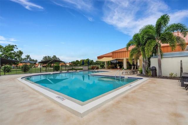 view of swimming pool with a patio area