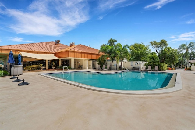 view of pool featuring a patio