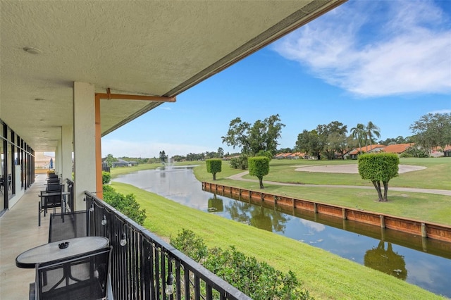 balcony featuring a water view