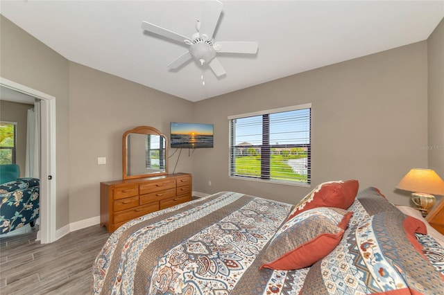 bedroom featuring ceiling fan and light wood-type flooring