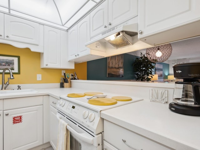 kitchen with white cabinetry, white range with electric cooktop, and sink