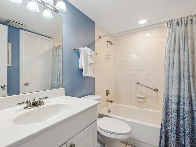 full bathroom featuring vanity, toilet, and shower / bath combo