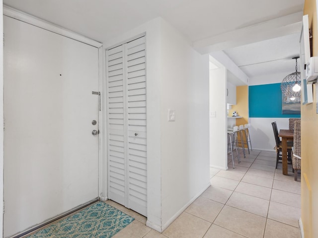 hall featuring light tile patterned floors