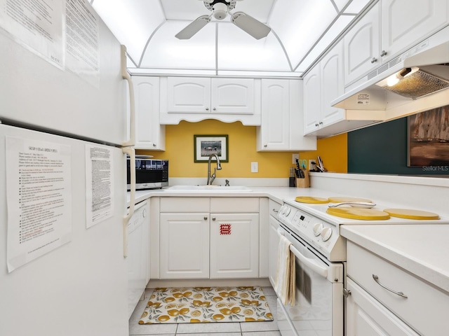 kitchen with ceiling fan, light tile patterned floors, sink, white appliances, and white cabinetry