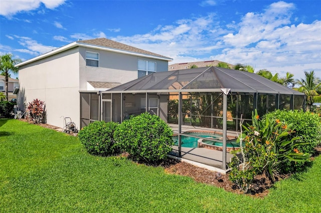 back of house featuring a yard and a lanai