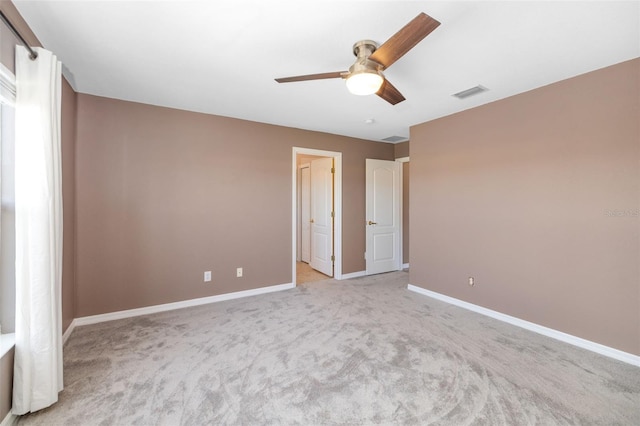 unfurnished bedroom featuring ceiling fan and light colored carpet