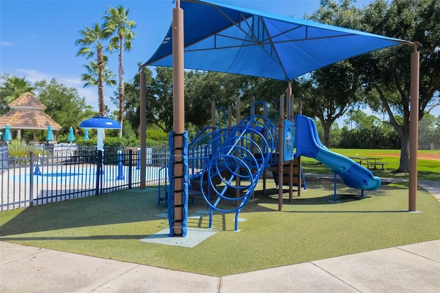 view of playground featuring a lawn