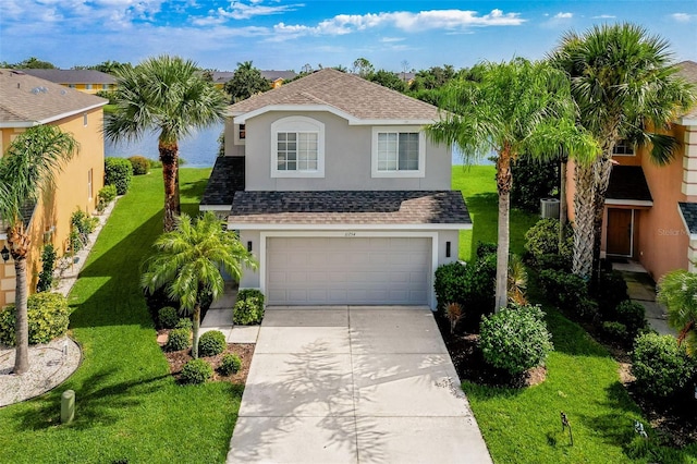 view of front of house featuring a front yard and a garage