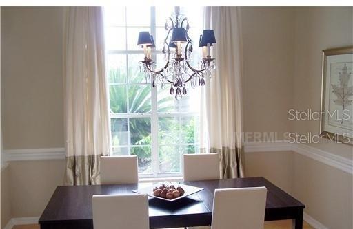 dining space with a chandelier