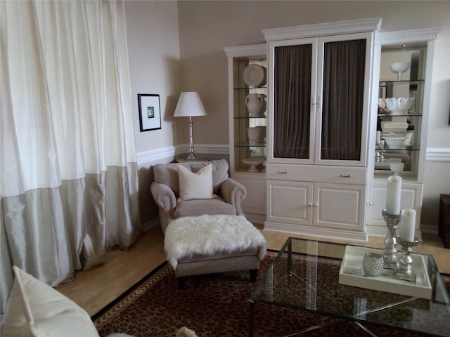 sitting room with hardwood / wood-style floors