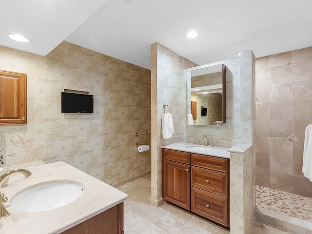 bathroom with walk in shower and vanity