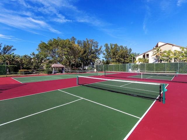 view of sport court with a gazebo and basketball hoop