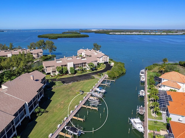 birds eye view of property featuring a water view