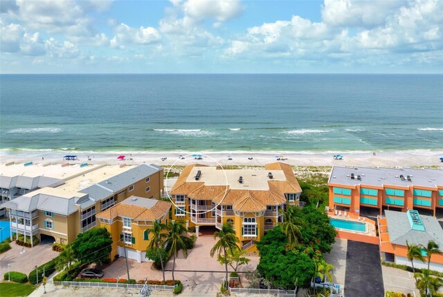 aerial view with a water view and a view of the beach