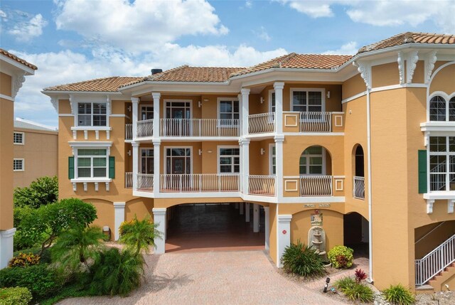 view of property with decorative driveway