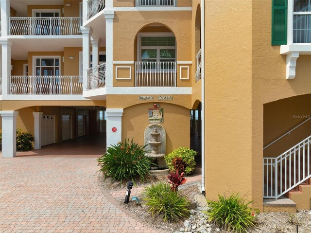 view of property featuring a garage and driveway