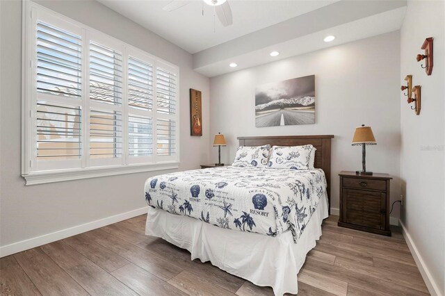 bedroom with recessed lighting, baseboards, wood finished floors, and a ceiling fan