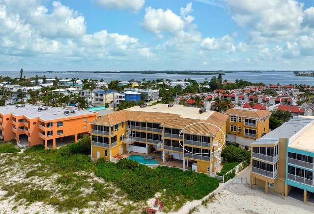 birds eye view of property featuring a water view and a residential view