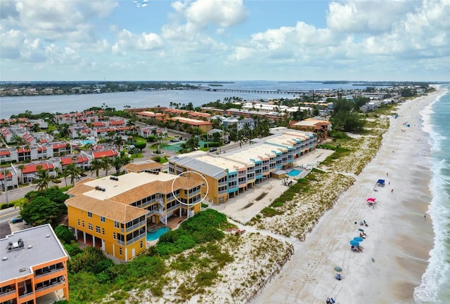 birds eye view of property with a view of the beach and a water view