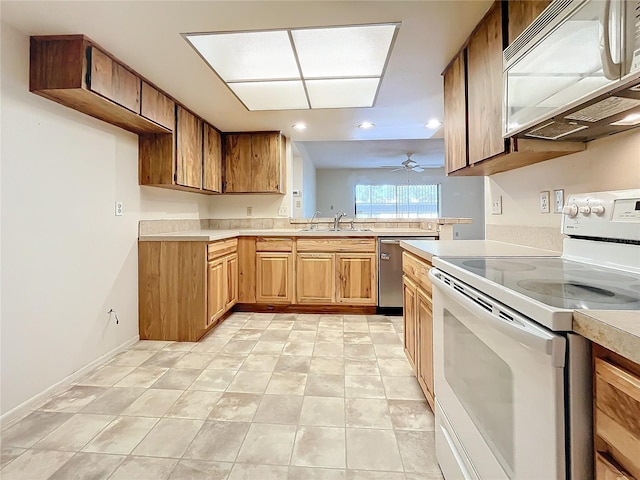 2587 Countryside Blvd Unit 6111, Clearwater, FL 33761 - kitchen with light countertops, white appliances, a sink, and recessed lighting